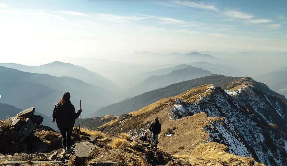 Hikers walking along a mountain ridge